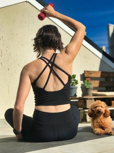 A relaxed home workout with a furry friend